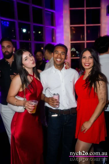 guests enjoying a Melbourne NYE event with drinks in hand