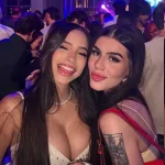 Elegant female friends dancing and laughing at a premium summer club night event in Melbourne